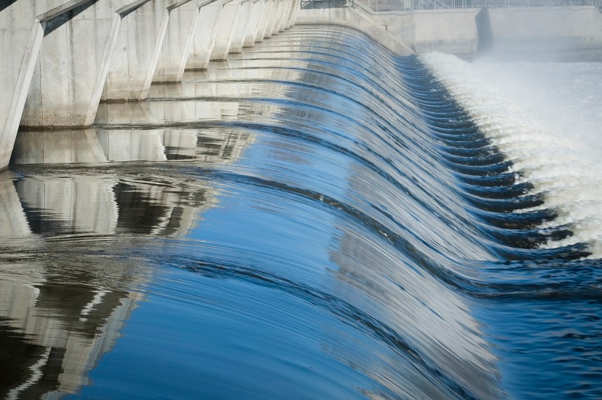 Water flowing through a dam
