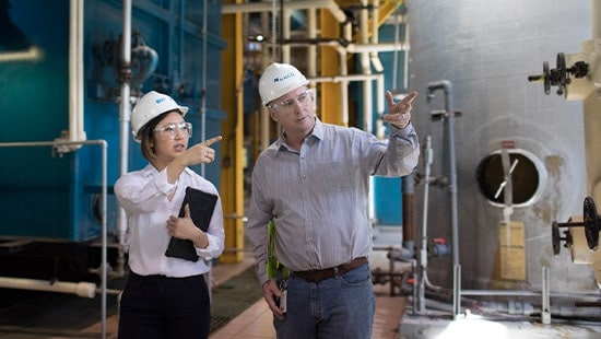 Ecolab expert in a manufacturing plant with a client