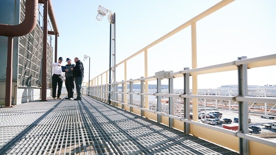   Ecolab expert with a client outside a manufacturing plant